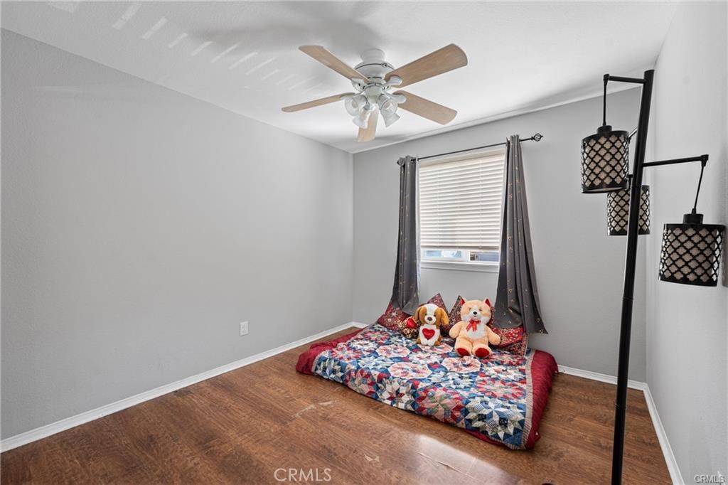 39351 Memory Drive Murrieta, CA 92563 - Photo 27 of 39 a bed room with a bed mirror and a window