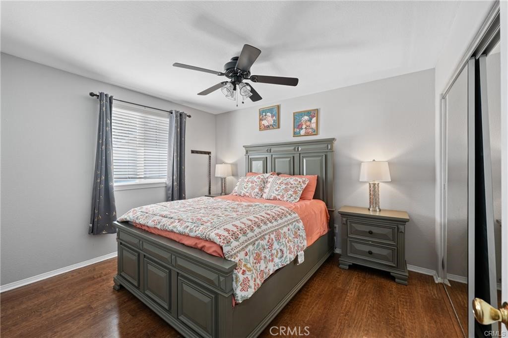 39351 Memory Drive Murrieta, CA 92563 - Photo 30 of 39 a bedroom with a bed a dresser and a window