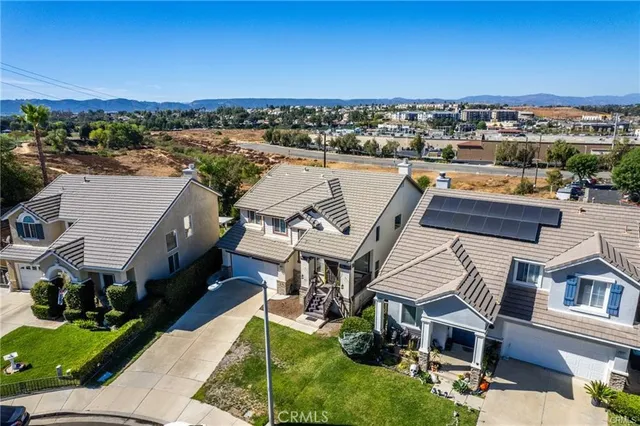 a aerial view of a house with a ocean view