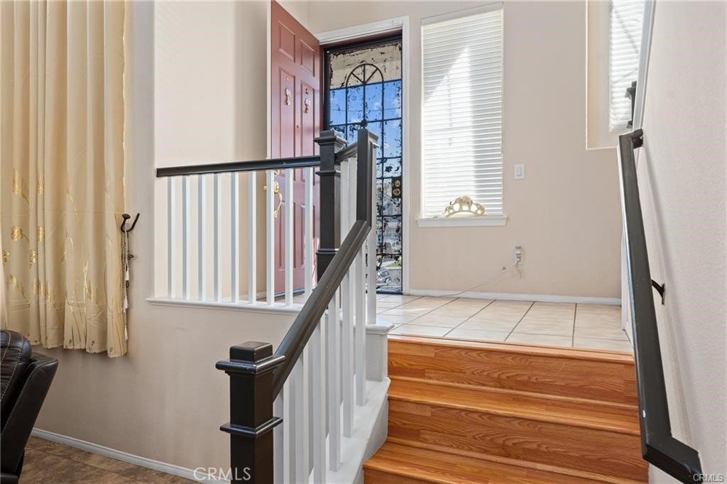 39351 Memory Drive Murrieta, CA 92563 - Photo 6 of 39 a view of staircase with white walls and a window