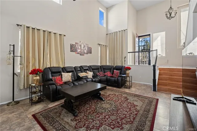 a living room with furniture and a rug