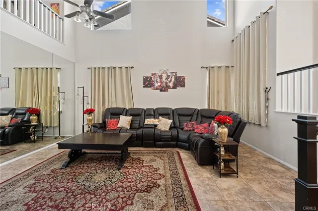 a living room with furniture and a rug