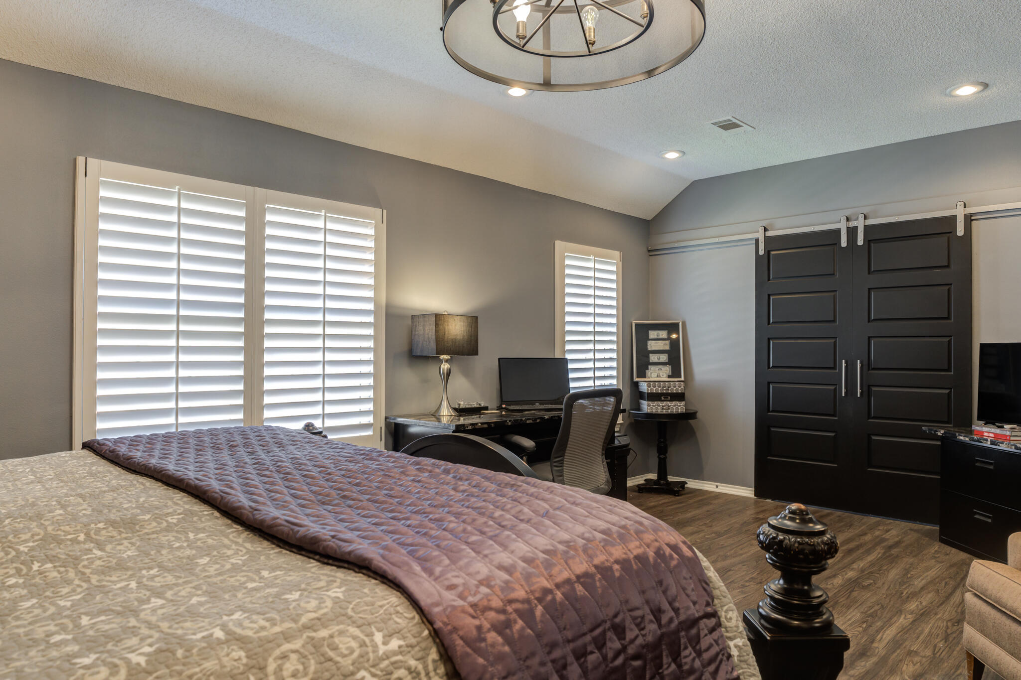6005 83rd Street Lubbock, TX 79424 - Photo 27 of 47 a bedroom with a bed and wooden floor