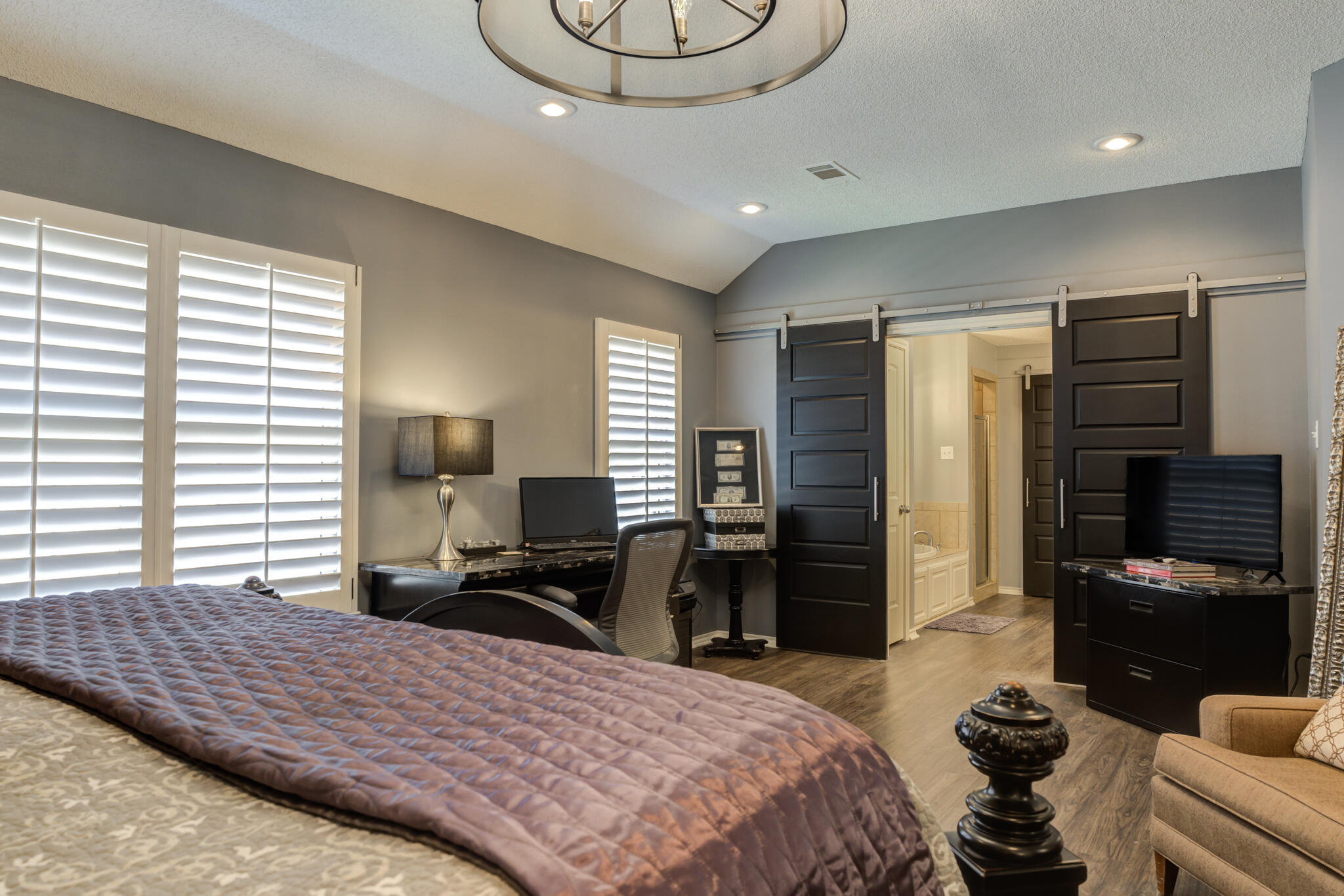 6005 83rd Street Lubbock, TX 79424 - Photo 28 of 47 a bedroom with a bed and wooden floor