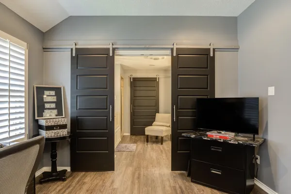 a living room with furniture and a flat screen tv