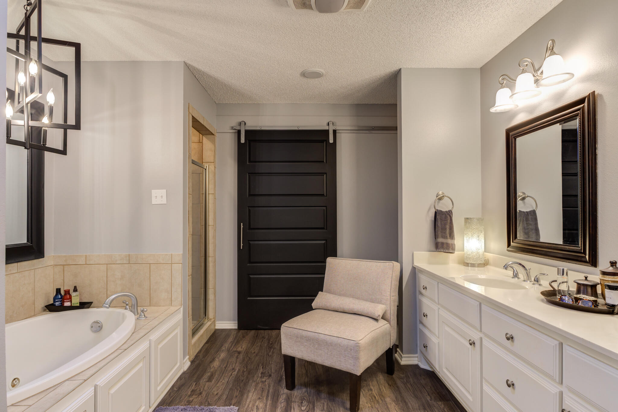6005 83rd Street Lubbock, TX 79424 - Photo 30 of 47 a bathroom with a tub sink and mirror