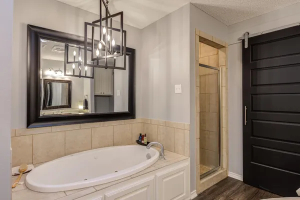 a bathroom with a bathtub and a shower