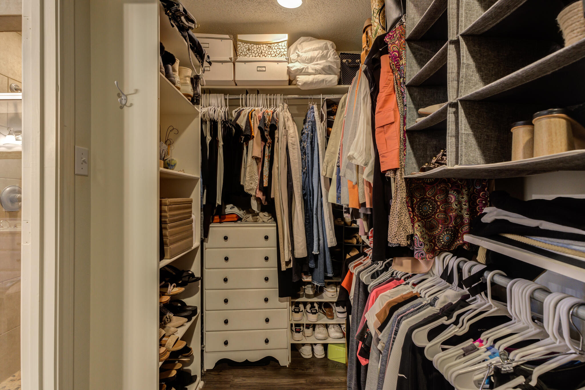 6005 83rd Street Lubbock, TX 79424 - Photo 33 of 47 a view of walk in closet with clothes and shoes