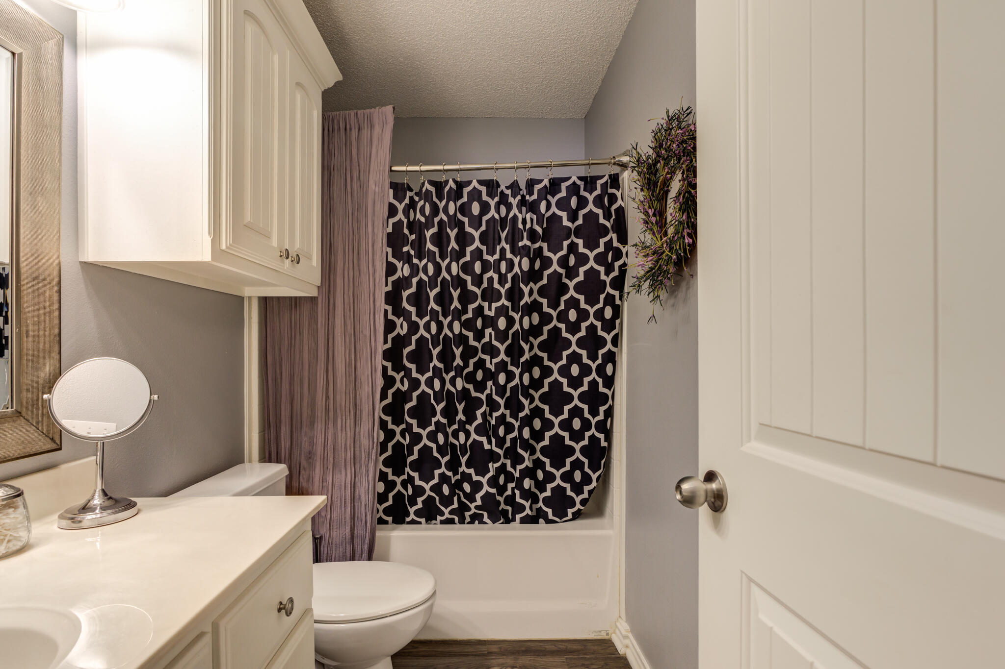 6005 83rd Street Lubbock, TX 79424 - Photo 38 of 47 a bathroom with a sink toilet and shower