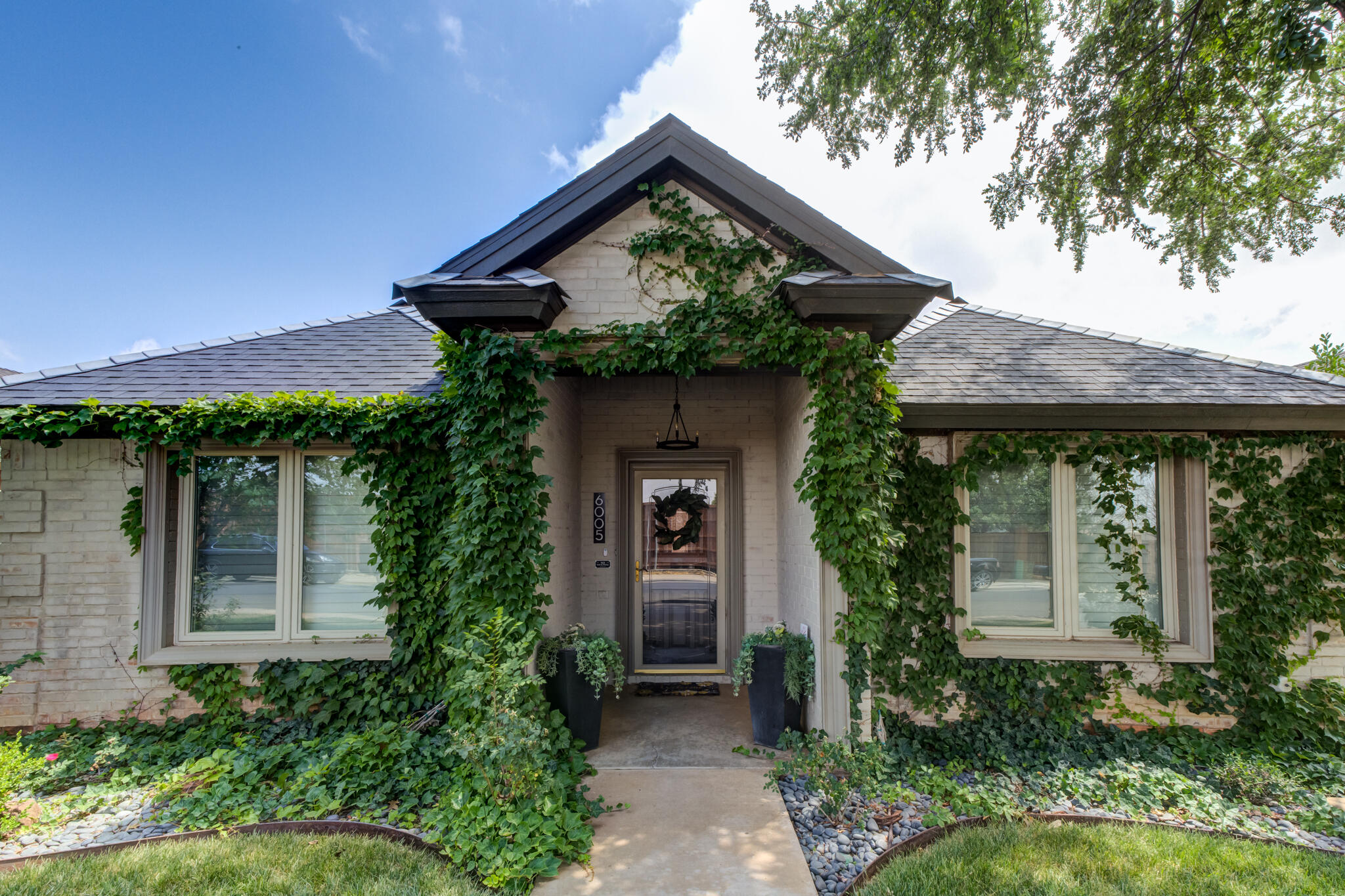 6005 83rd Street Lubbock, TX 79424 - Photo 9 of 47 a front view of a house with porch