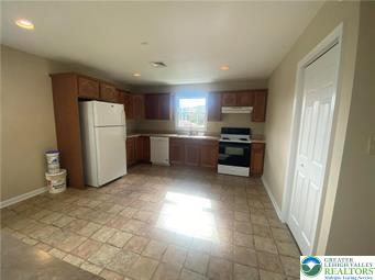 2430 Black River Road, Unit 4 Bethlehem, PA 18015 - Photo 3 of 8 a kitchen with a refrigerator and a sink
