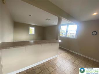 2430 Black River Road, Unit 4 Bethlehem, PA 18015 - Photo 4 of 8 an empty room with windows