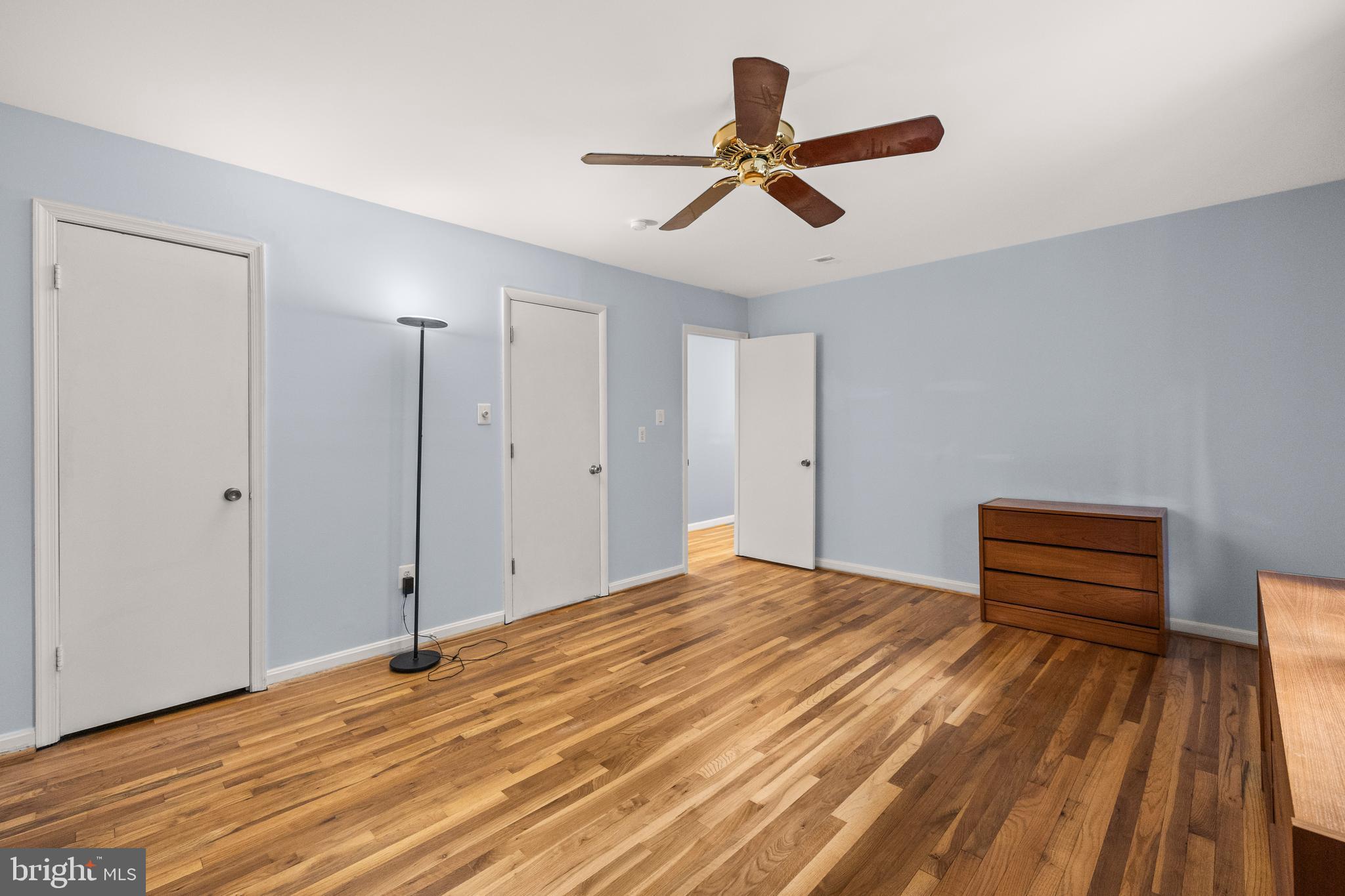 11110 Saffold Way Reston, VA 20190 - Photo 24 of 57 a bedroom with a bed and a dresser