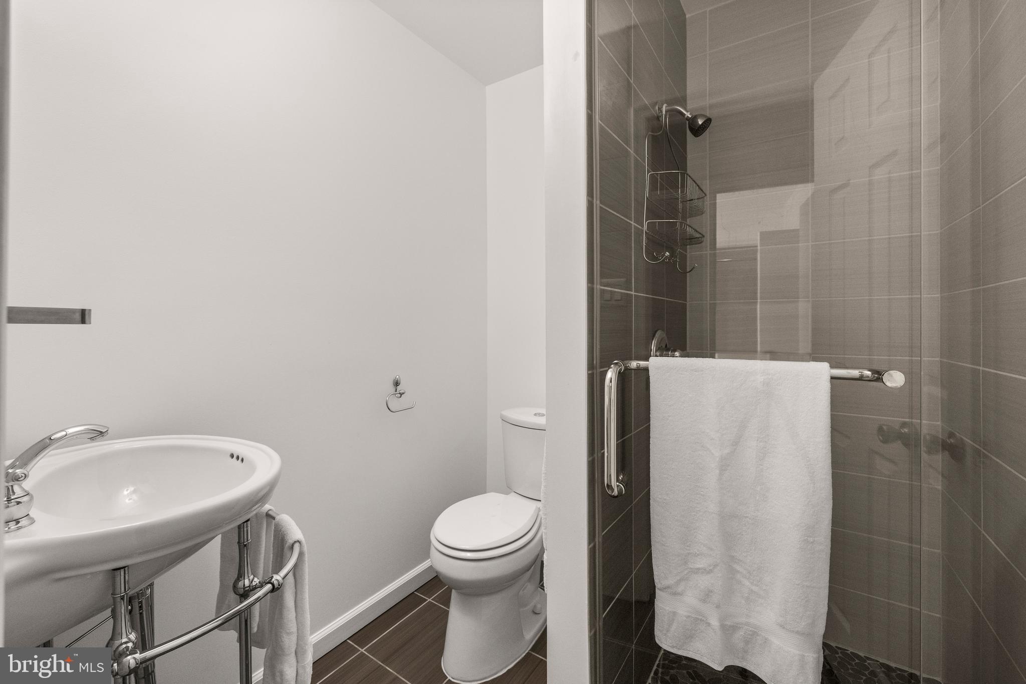 11110 Saffold Way Reston, VA 20190 - Photo 28 of 57 a bathroom with a toilet and a sink