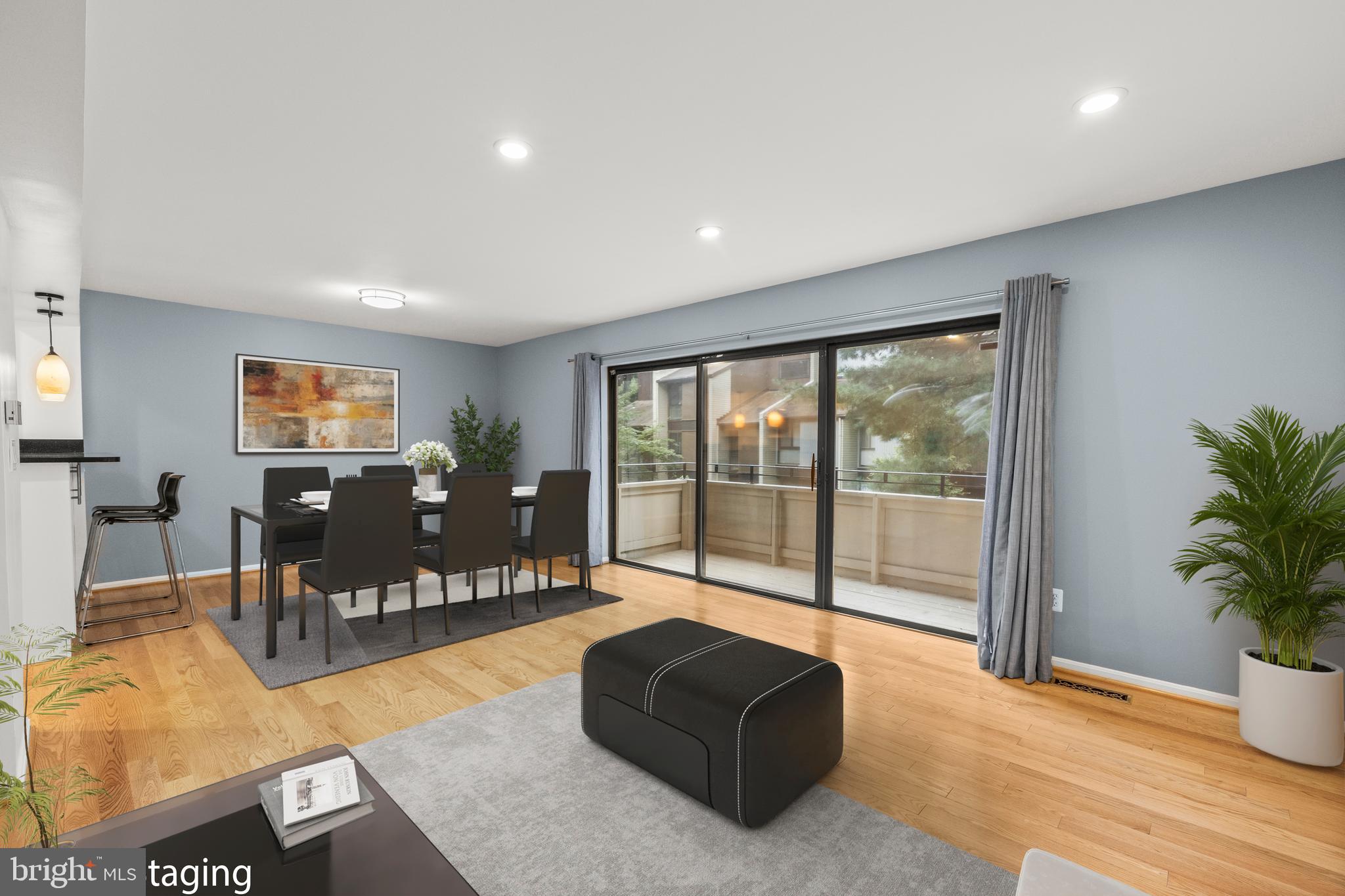 11110 Saffold Way Reston, VA 20190 - Photo 3 of 57 a living room with furniture large window and wooden floor