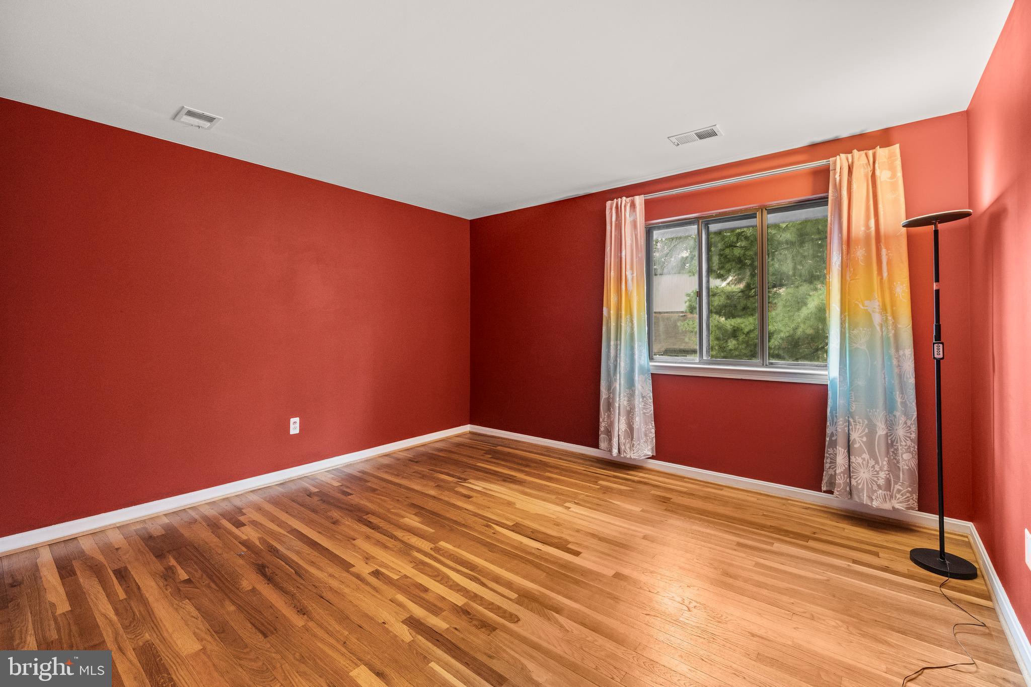 11110 Saffold Way Reston, VA 20190 - Photo 34 of 57 a view of empty room with wooden floor and fan