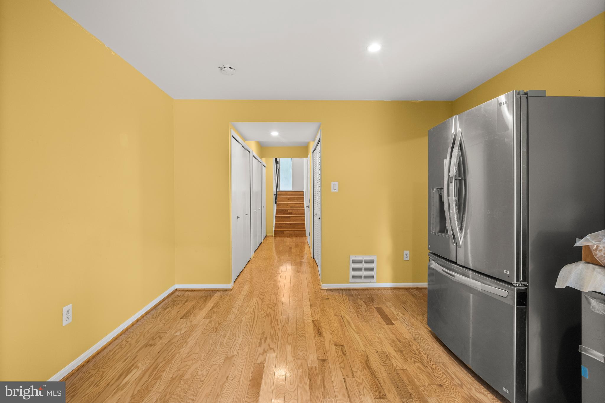 11110 Saffold Way Reston, VA 20190 - Photo 46 of 57 a view of a refrigerator in kitchen and wooden floor