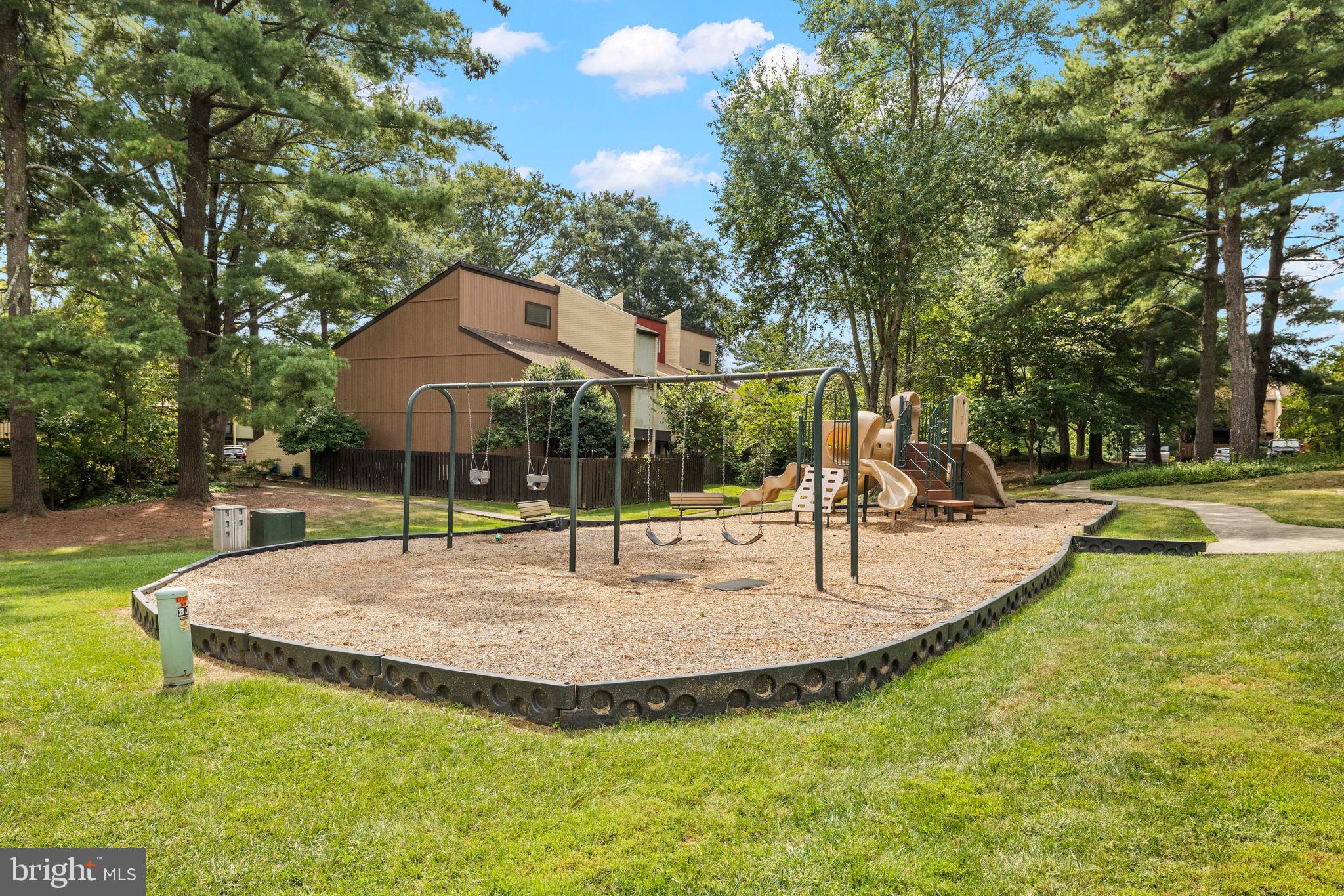 11110 Saffold Way Reston, VA 20190 - Photo 53 of 57 a view of a house with swimming pool and a garden