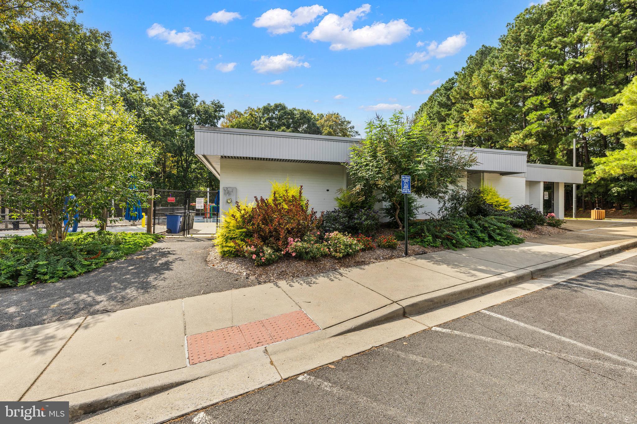 11110 Saffold Way Reston, VA 20190 - Photo 54 of 57 a front view of a house with a yard and a garage