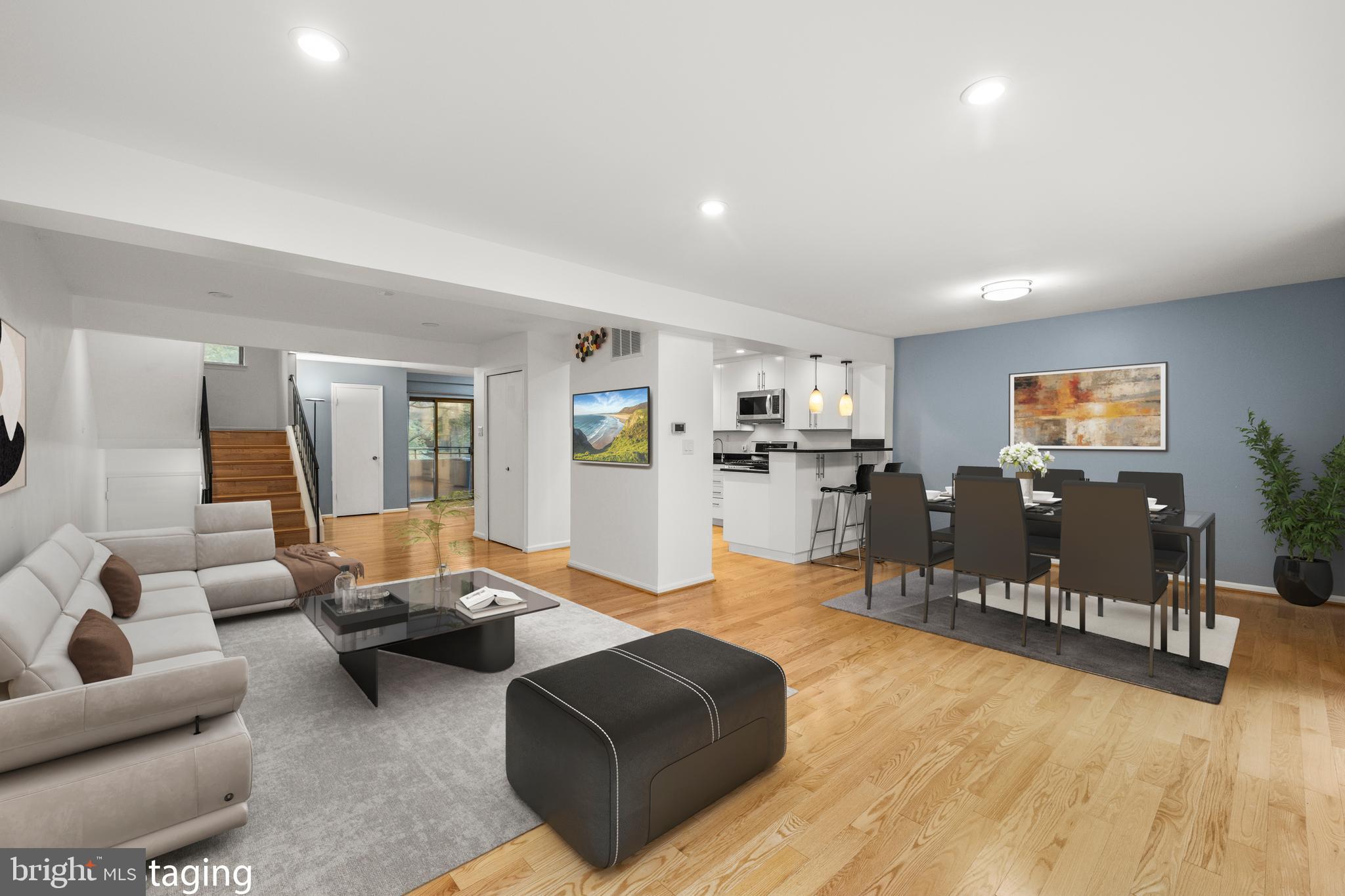 11110 Saffold Way Reston, VA 20190 - Photo 7 of 57 a living room with furniture and wooden floor