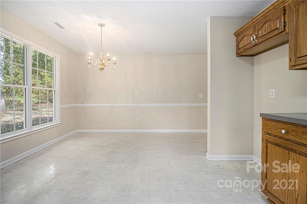 1327 Tucker Road Monroe, NC 28110 - Photo 8 of 19 a view of an empty room and a window