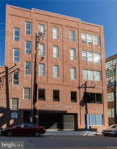 a front view of a building with a street