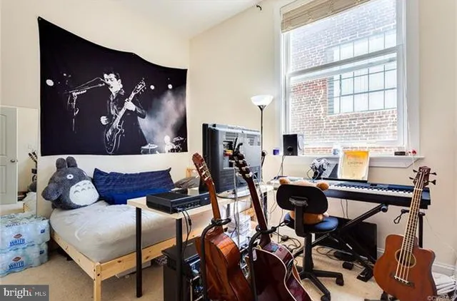 a work room with furniture and wooden floor