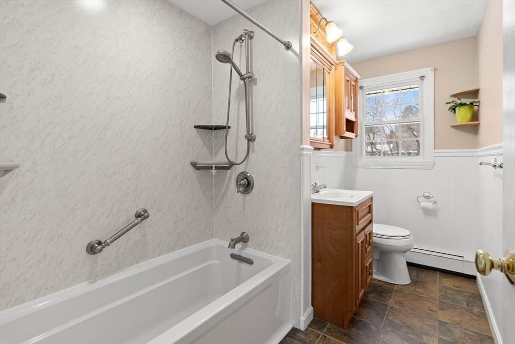 12 Tulane Road Danvers, MA 01923 - Photo 21 of 25 a bath room with a toilet and a bath tub