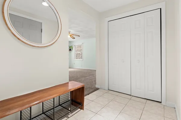 a view of a room with wooden floor and a table
