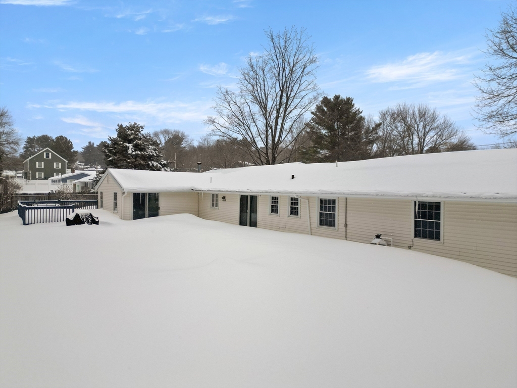 12 Tulane Road Danvers, MA 01923 - Photo 24 of 25 a large white building with a large tree in front