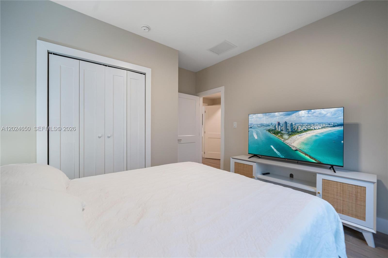 1663 Southwest 13th Street Miami, FL 33145 - Photo 39 of 112 a bedroom with a bed and a flat screen tv