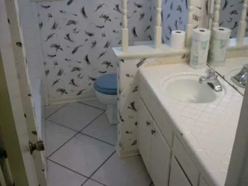 a bathroom with a sink and mirror