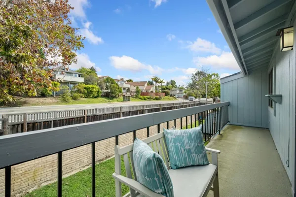a view of balcony with furniture