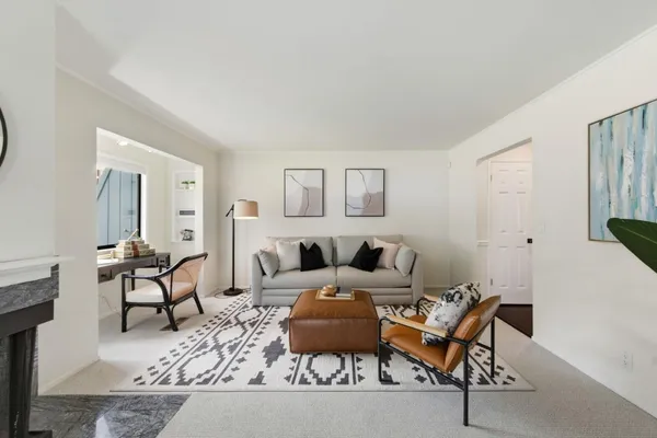 a living room with furniture and a table