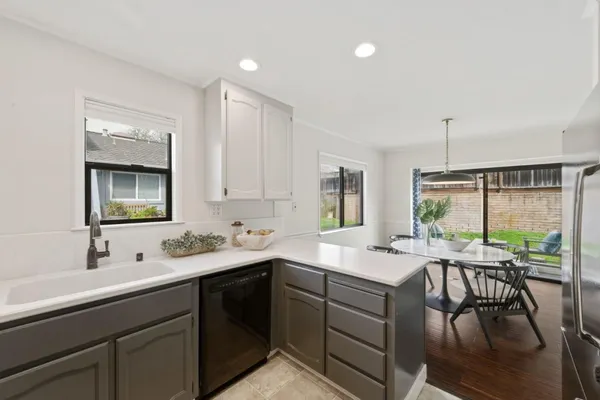 a view with a sink and cabinets