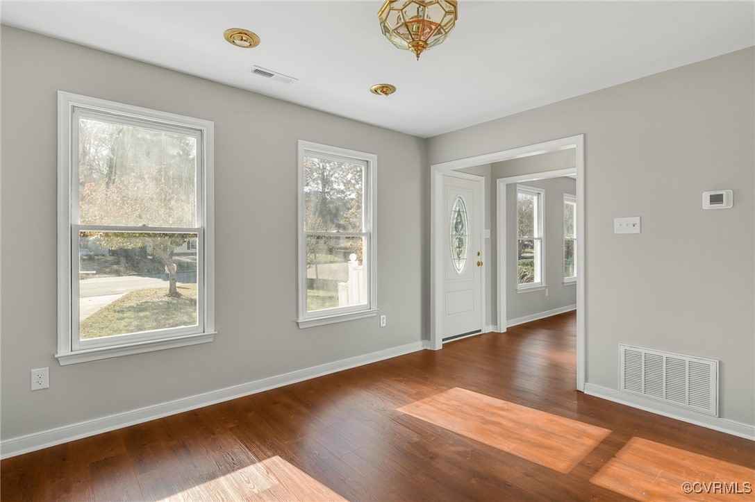 1301 Tree Ridge Road Henrico, VA 23231 - Photo 11 of 33 a view of an empty room with wooden floor and a window