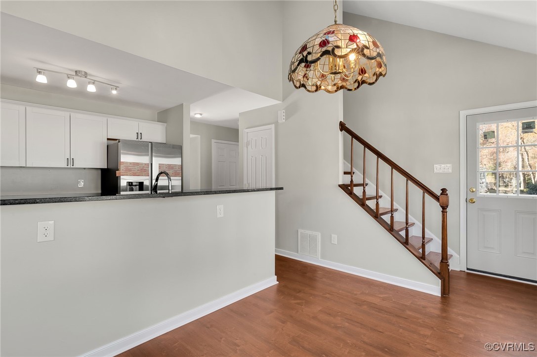1301 Tree Ridge Road Henrico, VA 23231 - Photo 15 of 33 a view of entryway with kitchen and wooden floor