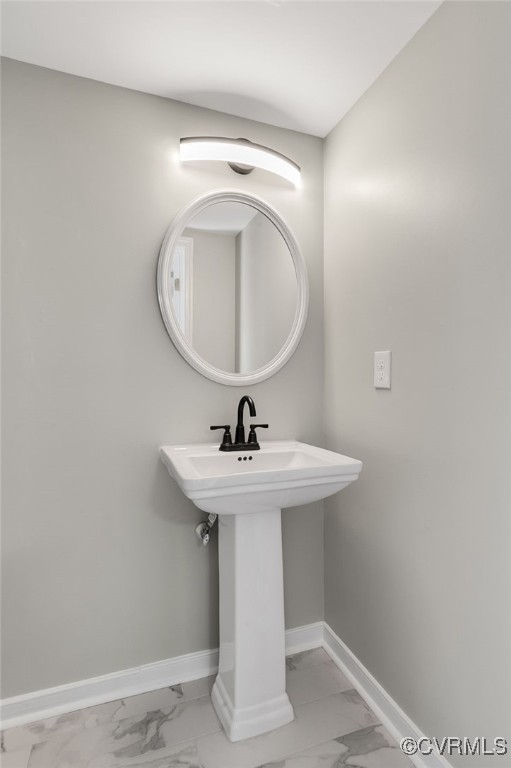 1301 Tree Ridge Road Henrico, VA 23231 - Photo 16 of 33 a bathroom with a sink a mirror and vanity