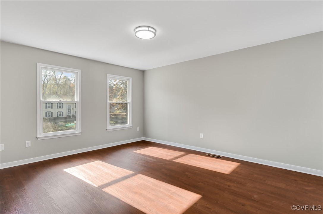 1301 Tree Ridge Road Henrico, VA 23231 - Photo 18 of 33 an empty room with wooden floor and windows