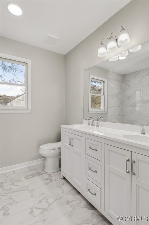 1301 Tree Ridge Road Henrico, VA 23231 - Photo 21 of 33 a bathroom with a toilet sink and mirror