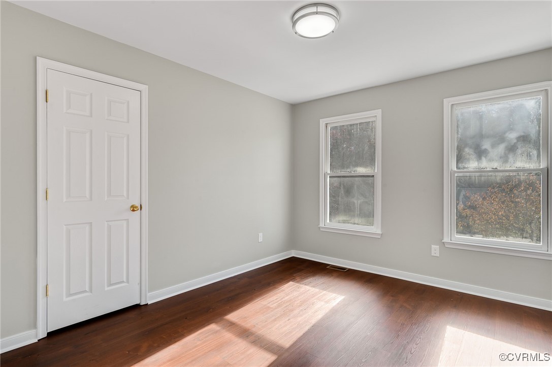 1301 Tree Ridge Road Henrico, VA 23231 - Photo 24 of 33 an empty room with wooden floor and windows