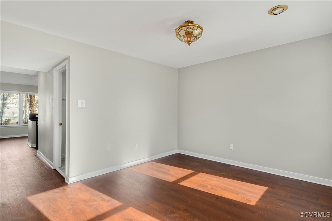 1301 Tree Ridge Road Henrico, VA 23231 - Photo 10 of 33 an empty room with wooden floor and windows
