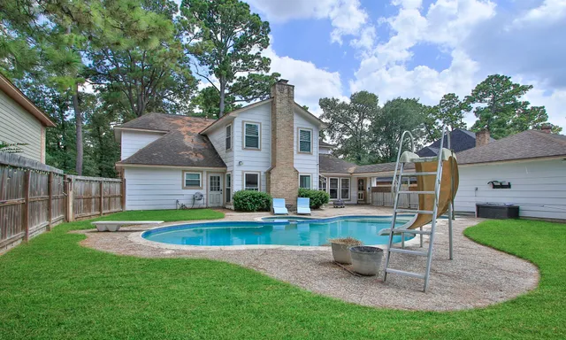 a front view of house with yard and outdoor seating