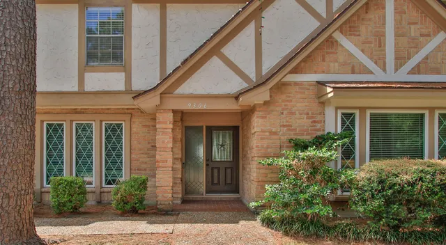 front view of a house with a small yard
