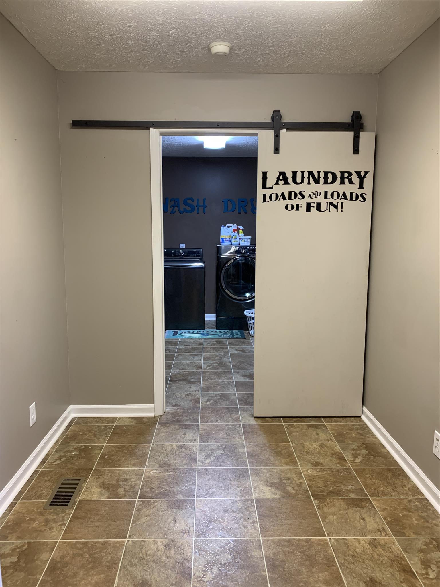 2261 Belotes Ferry Road Lebanon, TN 37087 - Photo 8 of 17 The mud room that slides open to the laundry room! So much space for a variety of needs!
