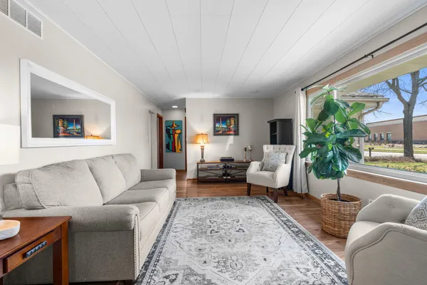 a living room with furniture and a large window