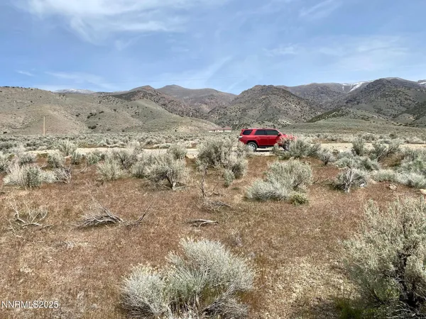 a view of a car in front of garage