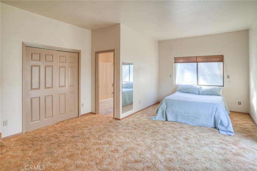 15 Hide A Way Road Oroville, CA 95966 - Photo 14 of 63 a spacious bedroom with a bed and a window