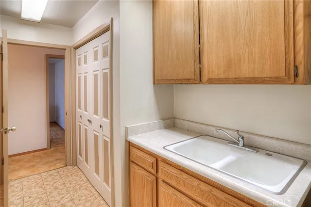 a view of a bathroom with a sink and mirror