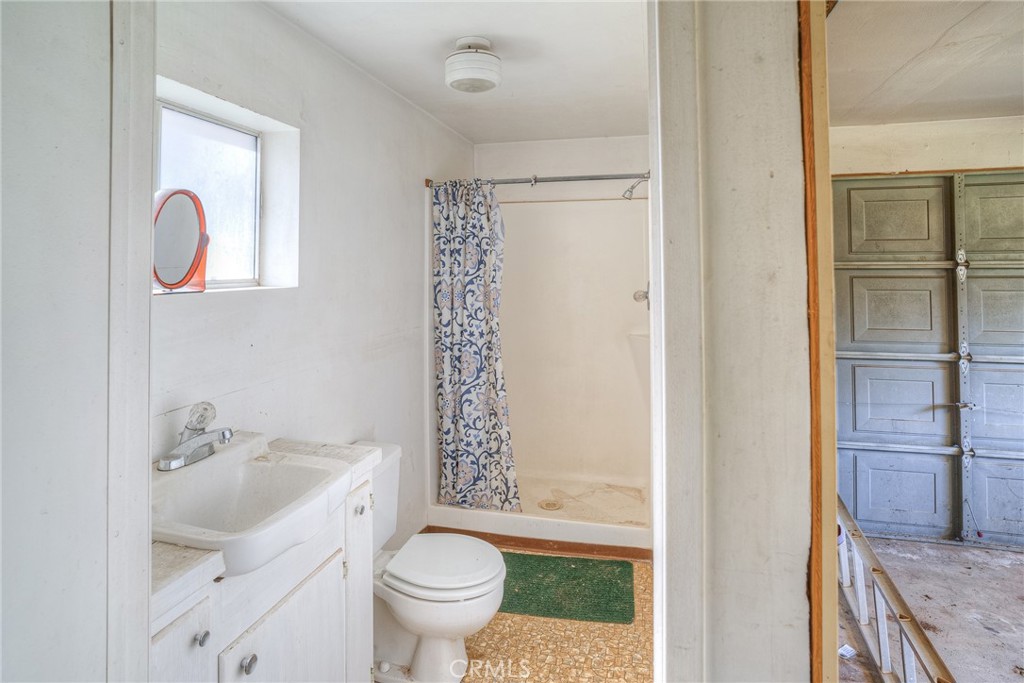 15 Hide A Way Road Oroville, CA 95966 - Photo 33 of 63 a bathroom with a sink toilet and shower